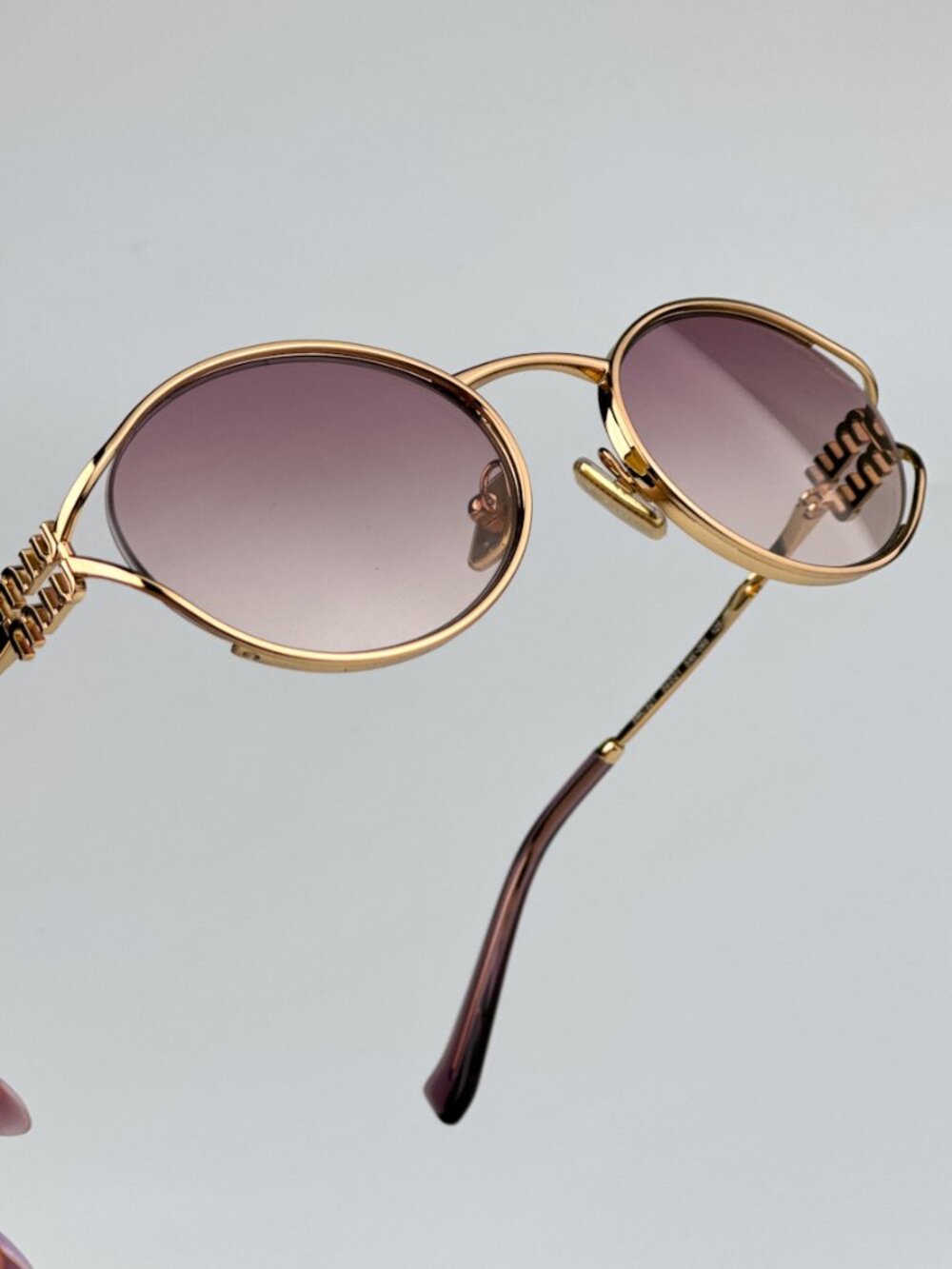 MIU MIU MU52YS 5AK06S GOLD OVAL SUNGLASSES